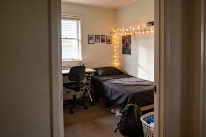 A teenager's bedroom refreshed on a budget with new bedding, fairy lights and a tidy desk.